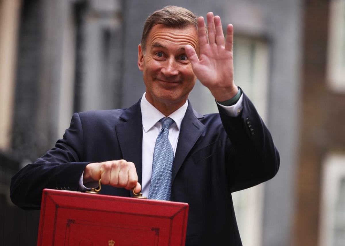 UK-Chancellor-Jeremy-Hunt-leaves-Downing-Street-with-the-despatch-box-to-present-his-spring-budget-to-parliament-on-March-15-2023-in-London-England.jpg